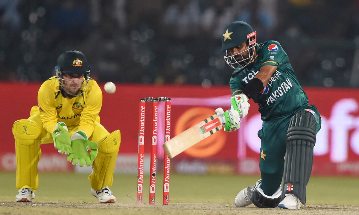 Pakistan's Babar Azam (right) plays a shot during the Twenty20 international cricket match between Pakistan and Australia in Lahore, Pakistan on April 5, 2022. Photo: AFP