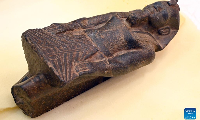 A smuggled Pharaonic artifact is displayed during the handover in Kuwait City, Kuwait, on June 16, 2022. Kuwait returned on Thursday five smuggled Pharaonic artifacts to Egypt, a Kuwaiti official said.(Photo: Xinhua)