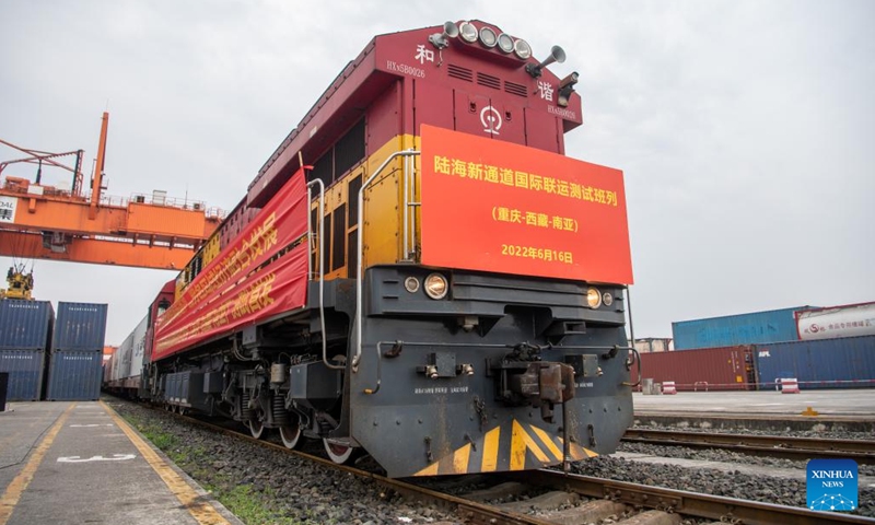An outbound international freight train is about to depart from a station in southwest China's Chongqing, June 16, 2022. The first outbound international freight train for test from China's Chongqing to South Asia pulled out of a station in southwest China's Chongqing Municipality on Thursday. The new route from Chongqing to Nepal's capital Kathmandu can save about 20 days on the way compared with traditional logistics routes.(Photo: Xinhua)