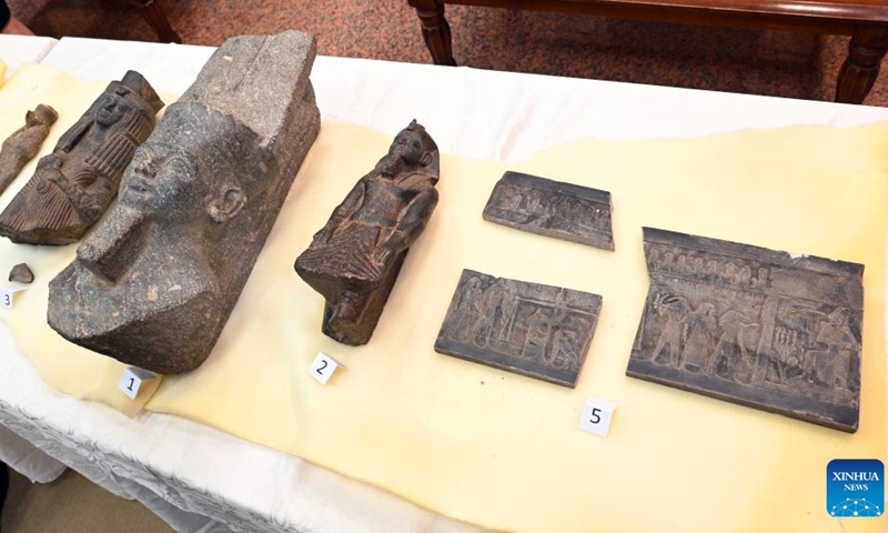 Smuggled Pharaonic artifacts are displayed during the handover in Kuwait City, Kuwait, on June 16, 2022. Kuwait returned on Thursday five smuggled Pharaonic artifacts to Egypt, a Kuwaiti official said.(Photo: Xinhua)