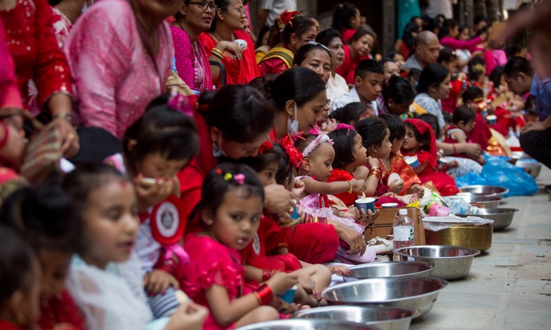 Girls dressed up as a living goddess participates in the celebration of the traditional Kumari Puja in Kathmandu, Nepal, June 18, 2022.Photo:Xinhua