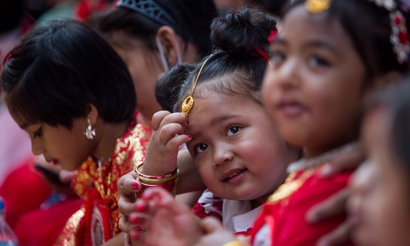 Girls dressed up as a living goddess participates in the celebration of the traditional Kumari Puja in Kathmandu, Nepal, June 18, 2022.Photo:Xinhua