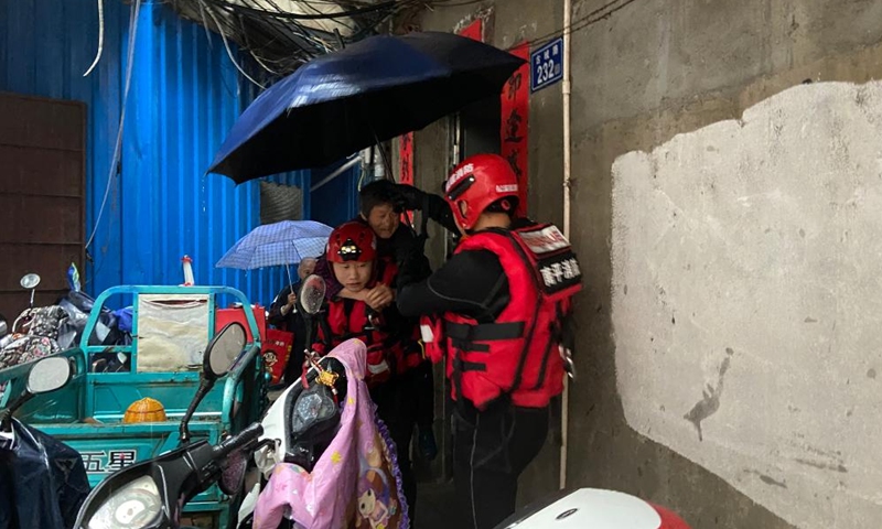 Rescuers evacuate stranded people in flood water in Songxi County of Nanping, southeast China's Fujian Province, June 18, 2022.Photo:Xinhua