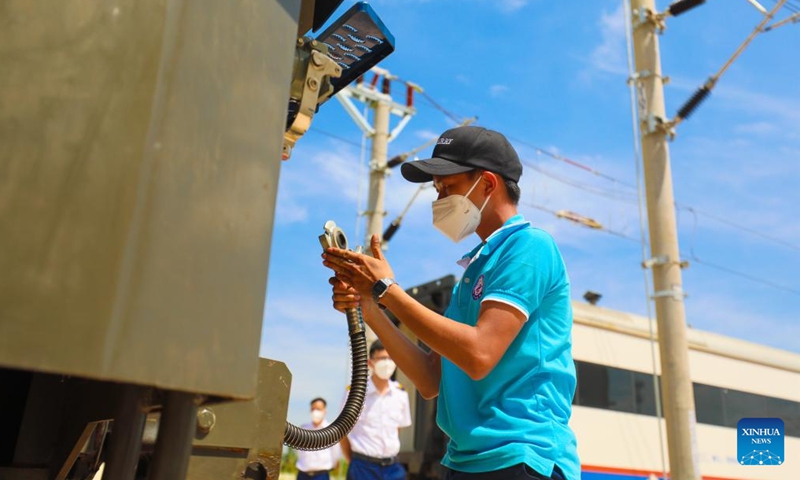 A Lao trainee practices for locomotive inspection before examination in Vientiane South Station of the China-Laos Railway in Laos, June 14, 2022.Photo:Xinhua