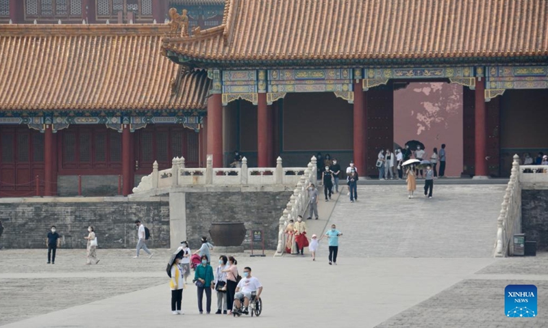 People visit the Palace Museum, also known as the Forbidden City, in Beijing, capital of China, June 19, 2022. As the epidemic situation in the city is improving, the number of visitors to the Palace Museum in Beijing has increased gradually.Photo:Xinhua