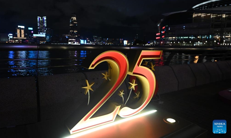 A celebratory decoration is illuminated for the 25th anniversary of Hong Kong's return to the motherland in Hong Kong, south China, June 18, 2022.Photo:Xinhua
