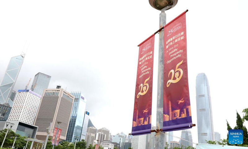Celebratory posters are seen at a street in Hong Kong, south China, June 19, 2022.Photo:Xinhua