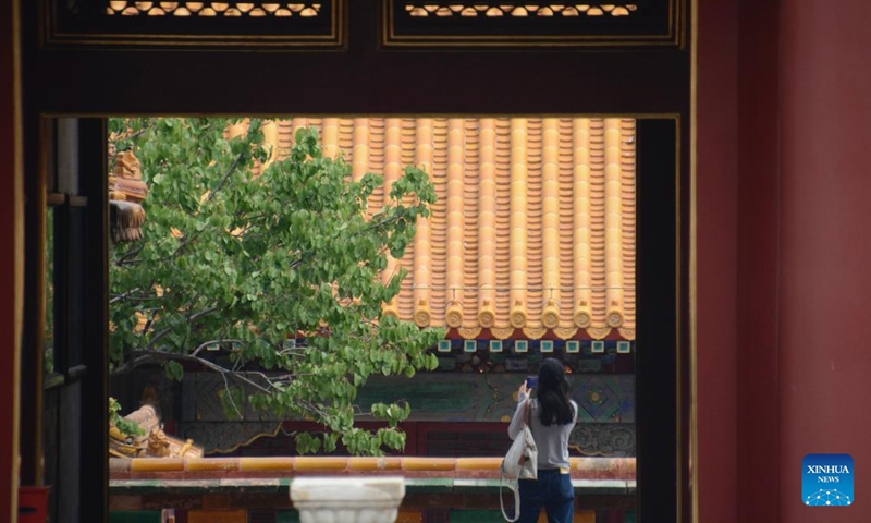 A woman visits the Palace Museum, also known as the Forbidden City, in Beijing, capital of China, June 19, 2022. As the epidemic situation in the city is improving, the number of visitors to the Palace Museum in Beijing has increased gradually.Photo:Xinhua