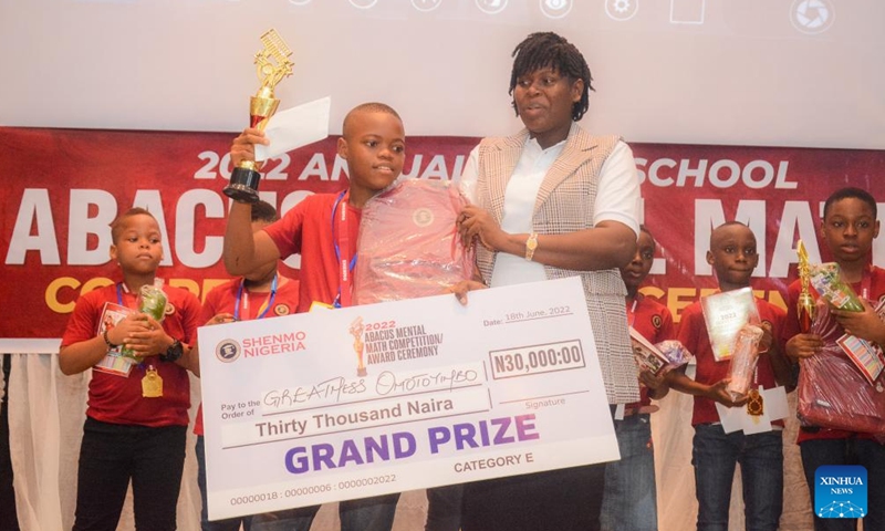 An award winning student poses for a photo at an abacus mental math competition in Port Harcourt, Nigeria, on June 18, 2022.Photo:Xinhua
