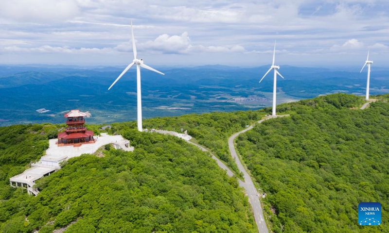 Aerial photo taken on June 19, 2022 shows wind turbines in Dadingzi Mountain Forest Park in Raohe County, northeast China's Heilongjiang Province.Photo:Xinhua