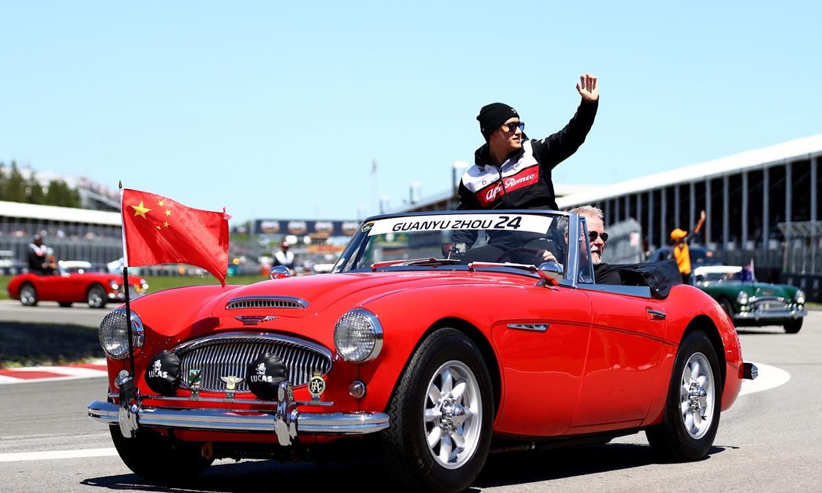 Zhou Guanyu of China and Alfa Romeo waves to the crowd on the drivers' parade ahead of the F1 Grand Prix of Canada on June 19, 2022 in Montreal, Quebec. Photo: VCG