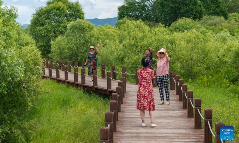 Tourists have fun at the Wusuli River National Wetland Park in northeast China's Heilongjiang Province on June 19, 2022.Photo:Xinhua