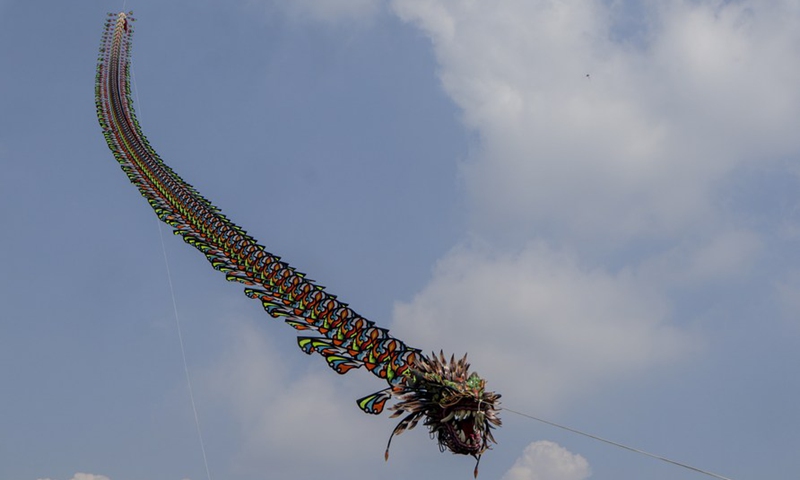 A dragon-shaped kite flies in the sky during the World Kite Festival in Bogor, West Java, Indonesia, June 19, 2022.Photo:Xinhua