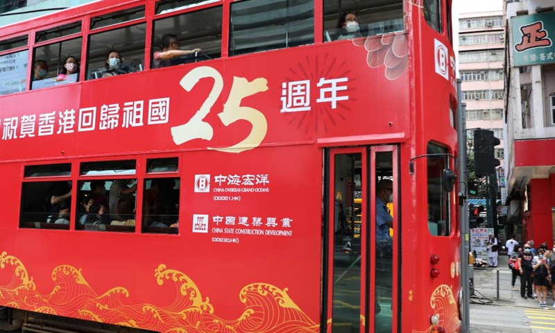 A tram covered with celebratory decoration is seen in Hong Kong, south China, June 19, 2022.Photo:Xinhua