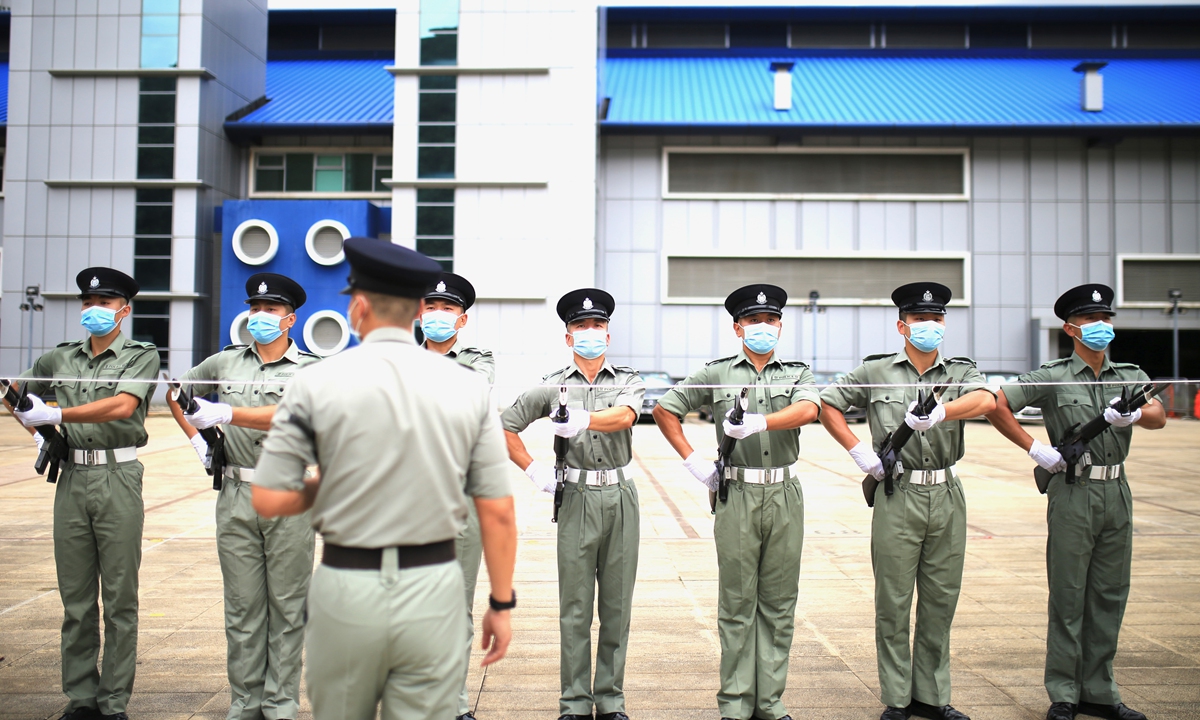Officers at the Hong Kong Police College in Wong Chuk Hang practice Chinese-style foot drills of the People's Liberation Army on June 21, 2022, ahead of the 25th anniversary of the Hong Kong Special Administrative Region's return to the motherland. Photo: Fan Lingzhi/GT 
