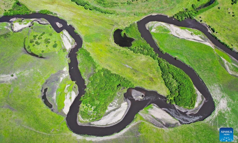Aerial photo taken on June 23, 2022 shows a river running through the Ulan Mod grassland in Horqin Right Wing Front Banner of Hinggan League, north China's Inner Mongolia Autonomous Region.(Photo: Xinhua)