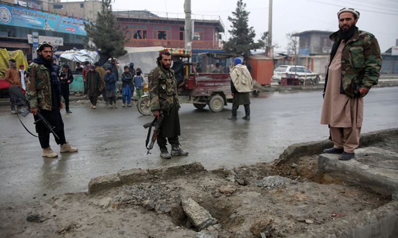 Taliban members inspect the site of a roadside bomb blast in Kabul, Afghanistan, on Jan. 16, 2022.(Photo: Xinhua)