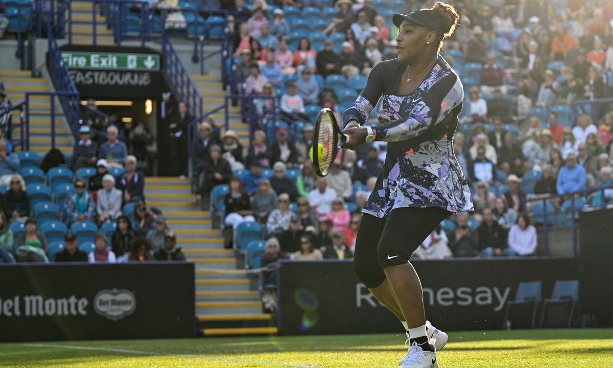 Serena Williams returns the ball during her women's doubles tennis match in Eastbourne, southern England on June 21, 2022. Photo: AFP 