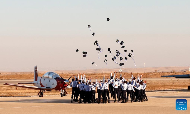 Cadets toss their caps during an Israeli Air Force (IAF) graduation ceremony at Hatzerim Airbase near Be'er Sheva, Israel, on June 23, 2022.(Photo: Xinhua)