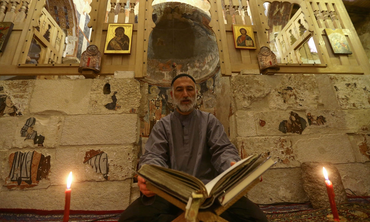 Father Jihad Youssef sits in prayer and contemplation at Deir Mar Moussa Al-Habashi on June 11, 2022. Photo: AFP