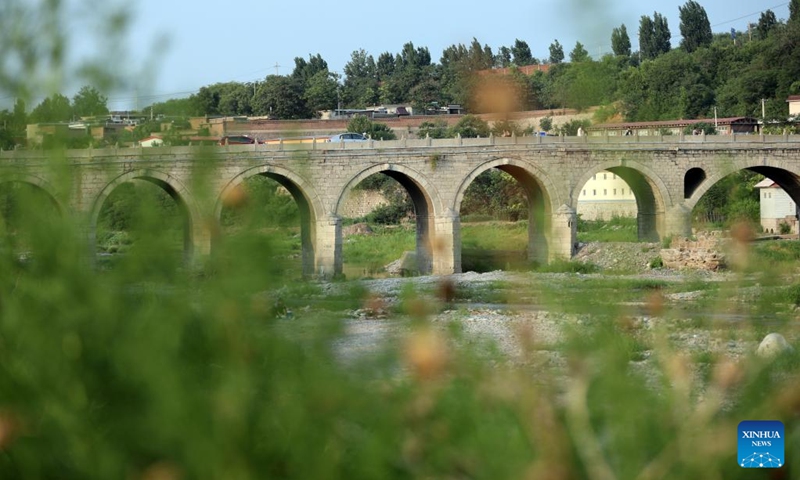 Photo taken on June 21, 2022 shows a stone bridge at an ancient town in Tianchang Township of Jingxing County, north China's Hebei Province. Historical sites have been renovated and infrastructure has been improved in the ancient town of Tianchang Township for better preserving the cultural heritage and attracting more tourists.(Photo: Xinhua)