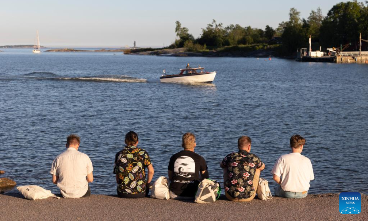 People celebrate Midsummer eve at Kaivopuisto Park in Helsinki, Finland, June 24, 2022. Midsummer Festival is an important festival and also one of the national holidays in Finland. Photo:Xinhua