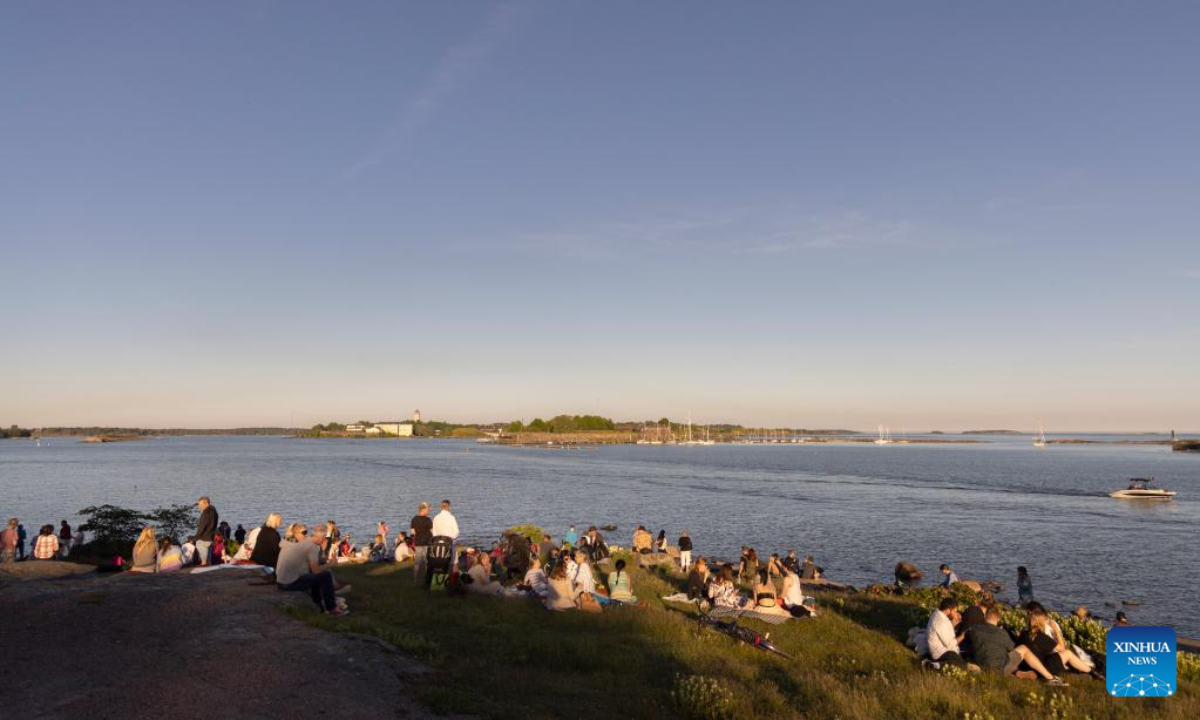 People celebrate Midsummer eve at Kaivopuisto Park in Helsinki, Finland, June 24, 2022. Midsummer Festival is an important festival and also one of the national holidays in Finland. Photo:Xinhua