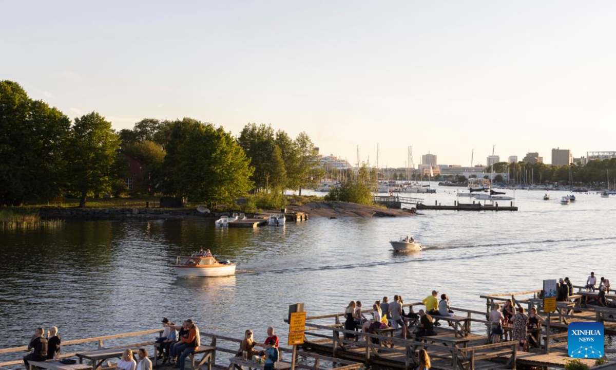 People celebrate Midsummer eve at Kaivopuisto Park in Helsinki, Finland, June 24, 2022. Midsummer Festival is an important festival and also one of the national holidays in Finland. Photo:Xinhua