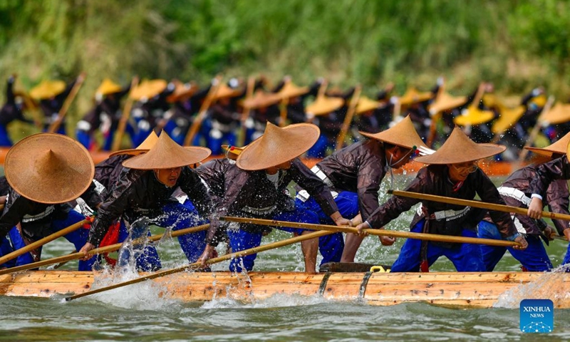 People of Miao ethic group take part in the canoe dragon boat festival in Shidong Town, Taijiang County of southwest China's Guizhou Province, June 23, 2022. The yearly canoe dragon boat festival of Miao ethnic group was held here on Thursday. (Xinhua/Yang Wenbin)