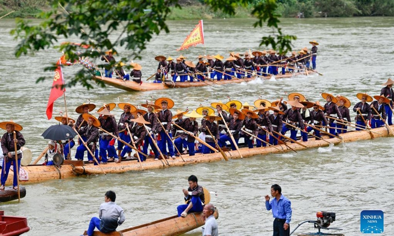 People of Miao ethic group take part in the canoe dragon boat festival in Shidong Town, Taijiang County of southwest China's Guizhou Province, June 23, 2022. The yearly canoe dragon boat festival of Miao ethnic group was held here on Thursday. (Xinhua/Yang Wenbin)