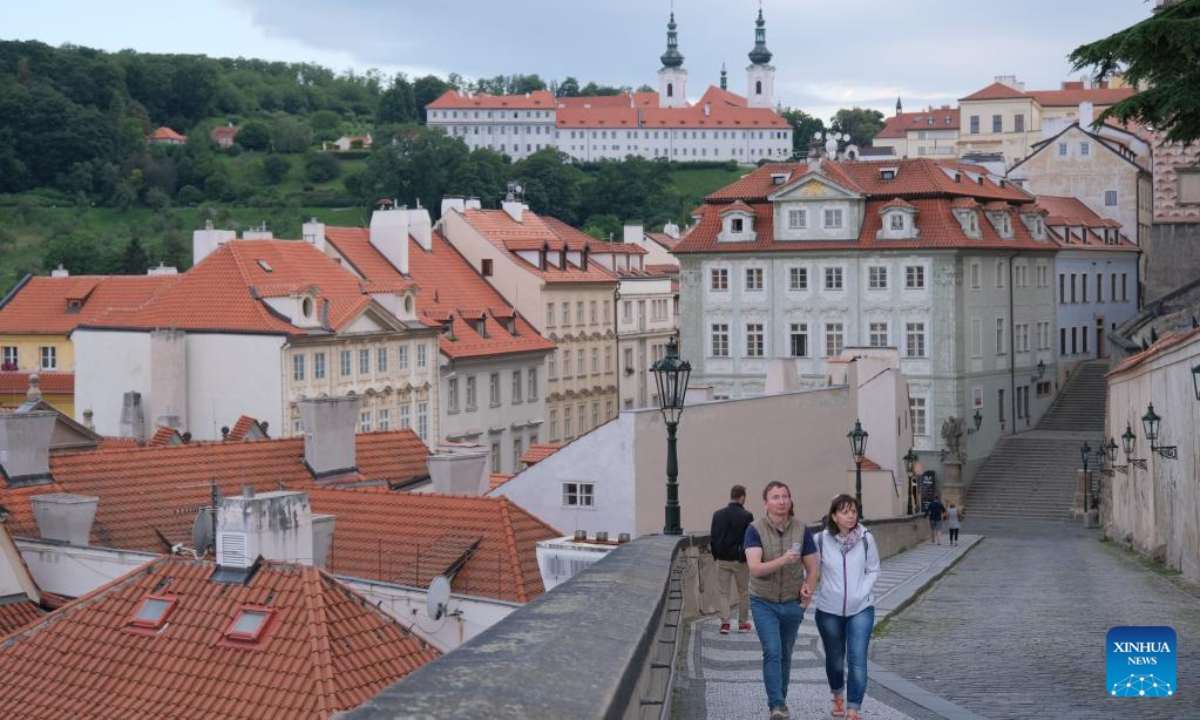 People walk on a street near the Prague Castle in Prague, capital of the Czech Republic, July 8, 2022. Photo:Xinhua