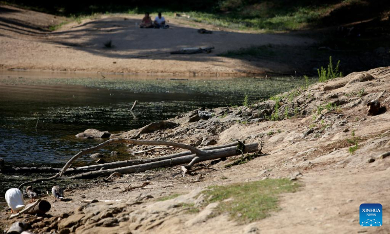Photo taken on July 9, 2022 shows the low water level of the Blue Lagoon in Sintra, Portugal. (Photo by Pedro Fiuza/Xinhua)