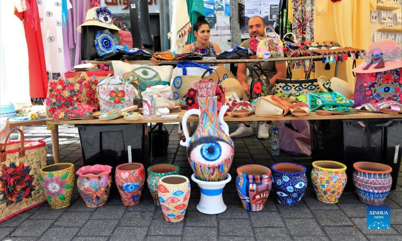 A handicraft booth is seen at the Life Beat Festival at the Hamra street in Beirut, Lebanon, June 26, 2022. (Xinhua/Liu Zongya)