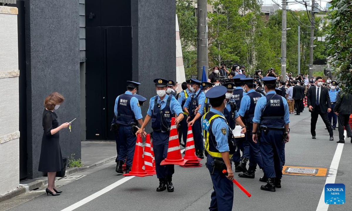 Police officers and journalists are seen near Shinzo Abe's residence in Tokyo, Japan, July 9, 2022. Former Japanese Prime Minister Shinzo Abe has died after being fatally shot Friday by a gunman during a speech in the western city of Nara when campaigning for Sunday's upper house election. Photo:Xinhua