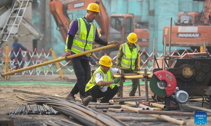 Constructors work at a construction site in Baotou, north China's Inner Mongolia Autonomous Region, June 24, 2022.Photo:Xinhua