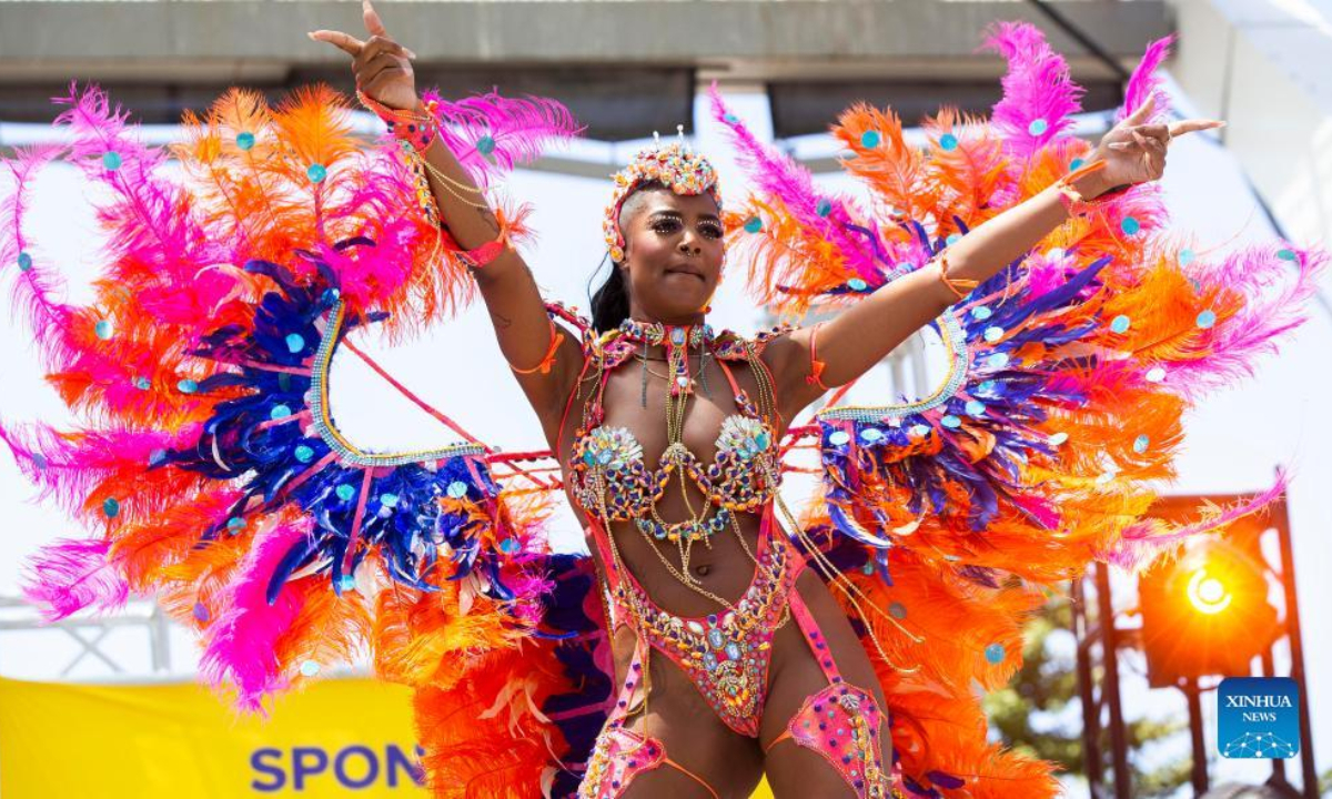 A dressed-up reveler dances during the official launch ceremony of the 2022 Toronto Caribbean Carnival in Toronto, Canada, on July 7, 2022. As a spectacular display of Caribbean music, costumes and culture, the annual event is held here from July 7 to July 31. Photo:Xinhua