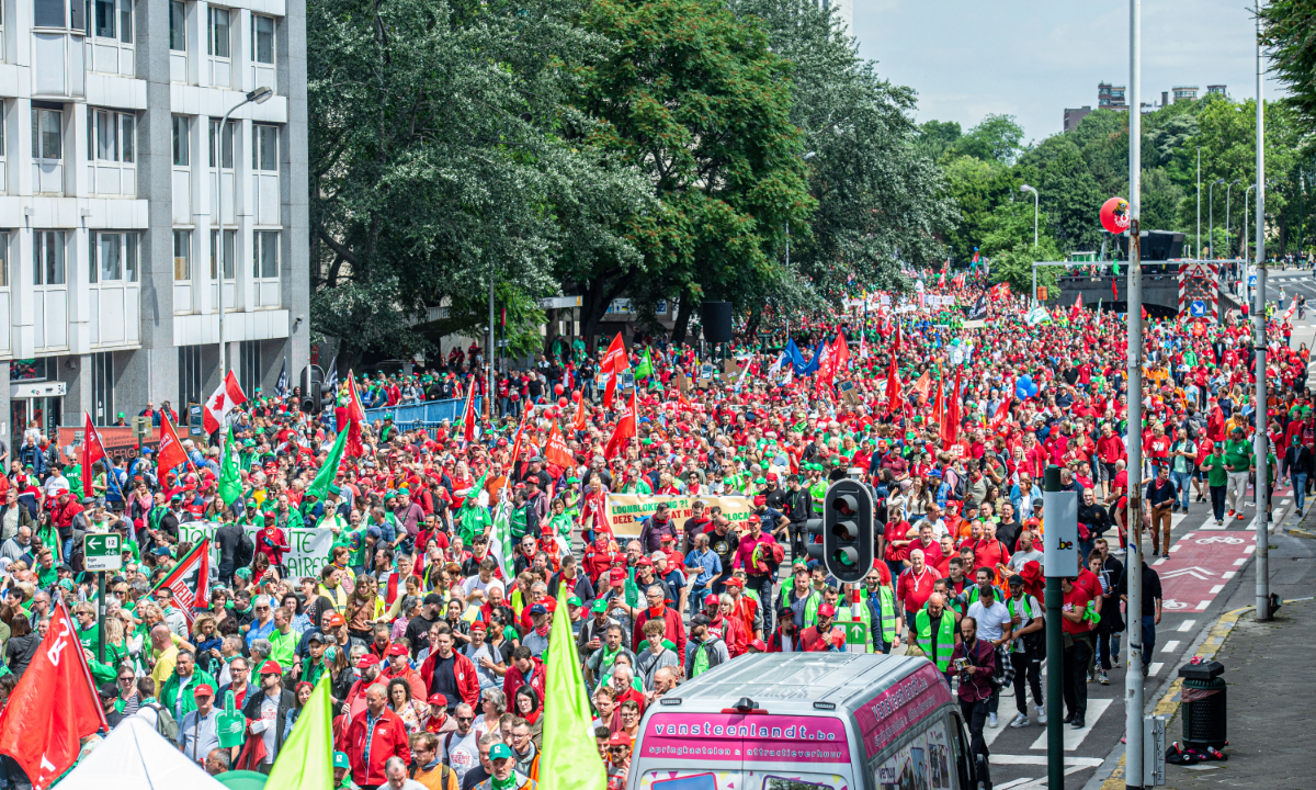 Protesters march during a national demonstration to defend purchasing power and demand an amendment to the 1996 wage standards law that regulates wage developments in Belgium, on June 20, 2022, in Brussels. Photo: AFP