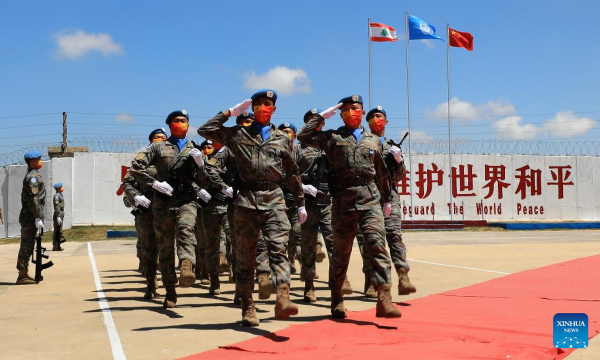 Chinese peacekeepers march at a medal parade ceremony in Hanniyah village, southern Lebanon, July 1, 2022. A total of 410 peacekeepers of the 20th Chinese peacekeeping contingent to Lebanon were awarded UN medals of peace on Friday. Photo:Xinhua