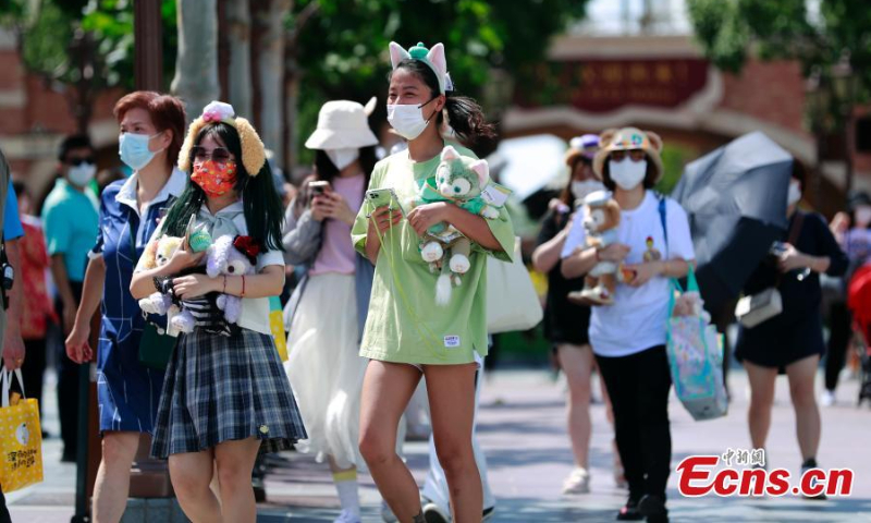 Visitors are seen at the Shanghai Disney Resort as it reopens on June 30, 2022. (Photo: China News Service/Tang Yanjun)