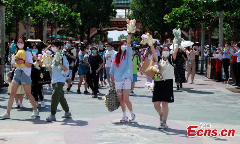 Visitors are seen at the Shanghai Disney Resort as it reopens on June 30, 2022. (Photo: China News Service/Tang Yanjun)