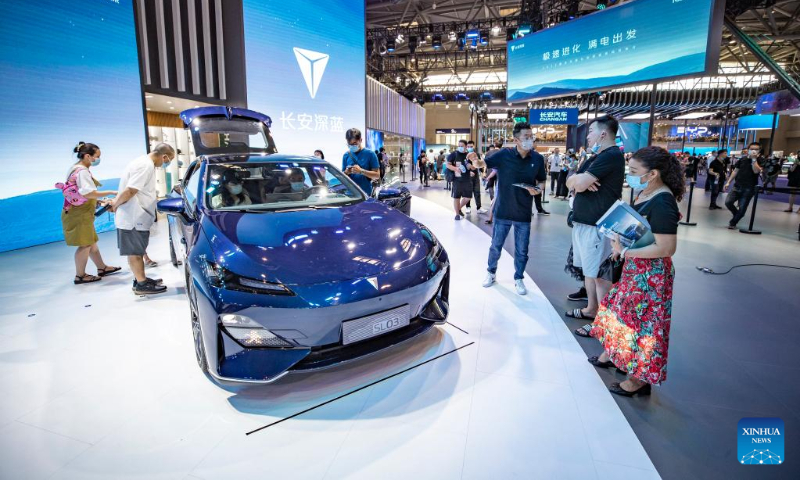 Visitors view a new energy vehicle during the 2022 Chongqing International Auto Exhibition in southwest China's Chongqing Municipality, June 25, 2022.