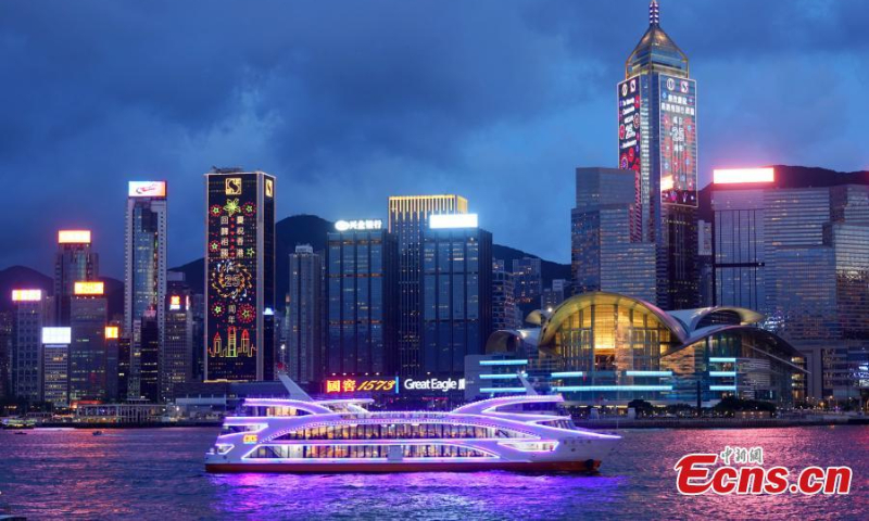 Light installations are illuminated to celebrate the 25th anniversary of Hong Kong's return to the motherland at the Victoria Harbor, the Hong Kong Special Administrative Region, June 29, 2022. (Photo: China News Service/Zhang Wei )