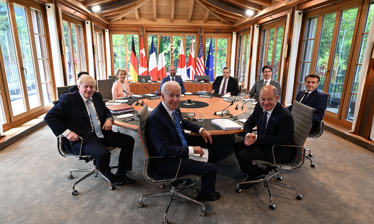 UK Prime Minister Boris Johnson (front left), US President Joe Biden (center) and German Chancellor Olaf Scholz (front right) and other leaders of the G7 sit at a session during the first day of the G7 Summit at Schloss Elmau, Germany, on June 26, 2022. Photo: AFP