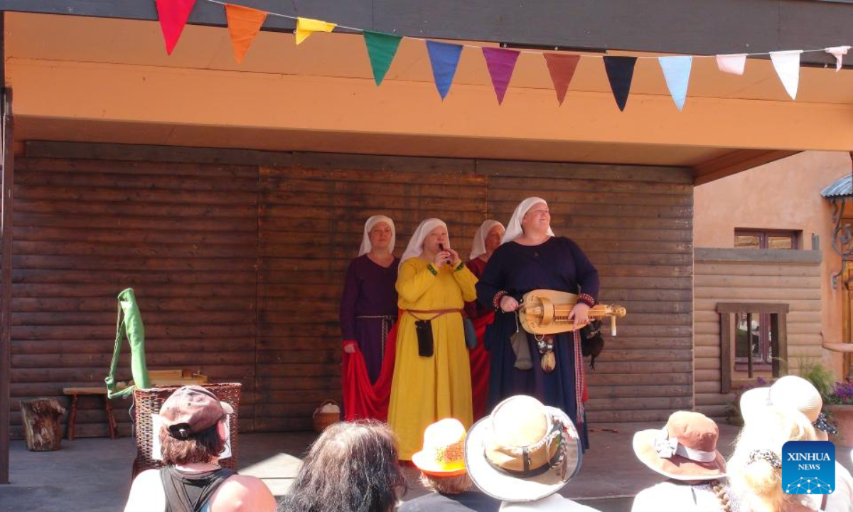 Musicians dressed in medieval costumes perform at the annual Medieval Market in Turku, Finland, June 30, 2022. The annual Medieval Market, one of the largest historical events in Finland, kicked off on Thursday. Visitors enjoy a robust medieval atmosphere with stall owners and actors dressed in medieval style costumes at the market. Photo:Xinhua