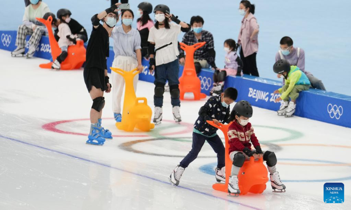 People visit the National Speed Skating Oval in Beijing, capital of China, July 9, 2022. The National Speed Skating Oval, also known as the Ice Ribbon, opened to the public on Saturday. Photo:Xinhua