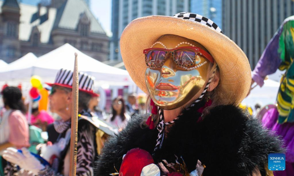 A dressed-up reveler is seen during the official launch ceremony of the 2022 Toronto Caribbean Carnival in Toronto, Canada, on July 7, 2022. As a spectacular display of Caribbean music, costumes and culture, the annual event is held here from July 7 to July 31. Photo:Xinhua