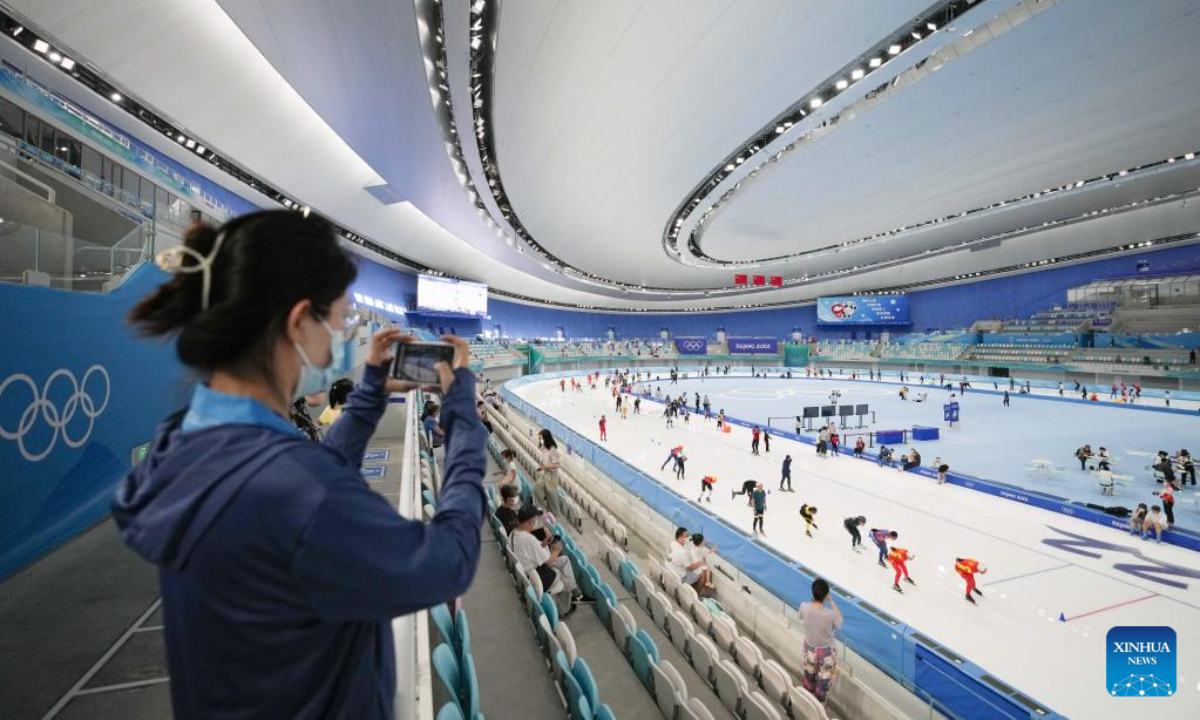 A tourist takes photos at the National Speed Skating Oval in Beijing, capital of China, July 9, 2022. The National Speed Skating Oval, also known as the Ice Ribbon, opened to the public on Saturday. Photo:Xinhua