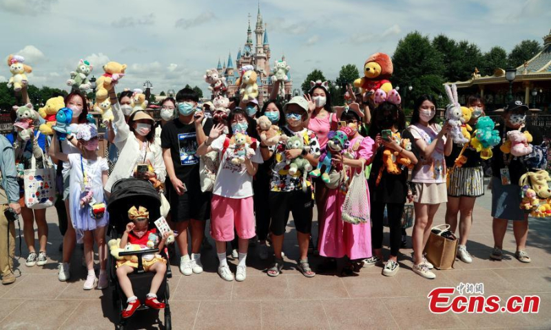 Visitors enter the Shanghai Disney Resort as it reopens on June 30, 2022. (Photo: China News Service/Tang Yanjun)