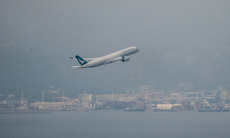 A passenger aircraft operated by Cathay Pacific Airways Ltd. takes off from the Hong Kong International Airport in Hong Kong, China, on March 7, 2022. Photo: VCG