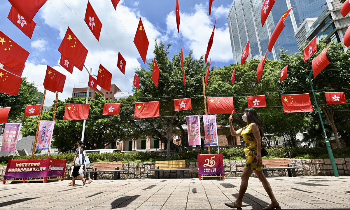 China's national flag and the flag of Hong Kong Special Administrative Region hanging over the streets in Hong Kong on June 17, 2022 Photo: VCG